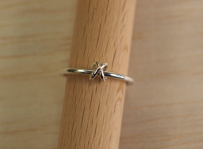 A sterling silver anxiety ring with a bead design.