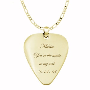May include: Gold guitar pick necklace with the inscription "Maria You're the music to my soul 2-14-18".