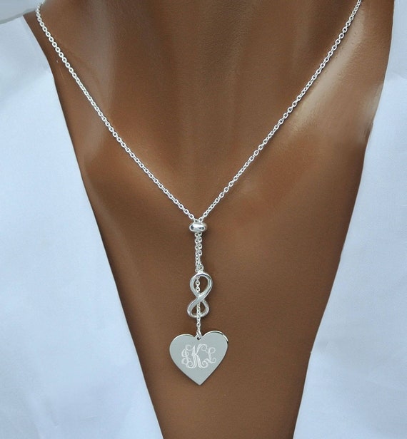 1/20 CT. T.W. Diamond Heart with Infinity Pendant in 10K Gold | Zales Outlet