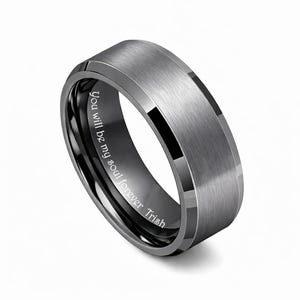 May include: A gray tungsten ring with a brushed finish and a black interior. The ring has a beveled edge and the inscription "You will be my soul forever Trish" is engraved on the inside.