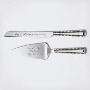 May include: A silver cake knife and server set with engraved text. The knife has the text "Amy & Robert as one forever". The server has the text "Mr. & Mrs. Collette May 26, 2019".