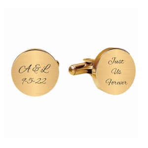 May include: Gold cufflinks with a round design. One cufflink is engraved with "A & L 9-5-22" and the other cufflink is engraved with "Just Us Forever".