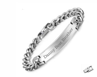 May include: A silver-toned metal curb chain bracelet featuring a central rectangular identification plate engraved with the text Danny Best Brother. The bracelet includes a separate small metal extender piece shown in the corner.