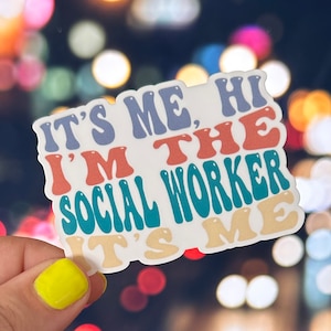 May include: A white sticker with the text "It's me, hi I'm the social worker it's me" in colorful, wavy letters.
