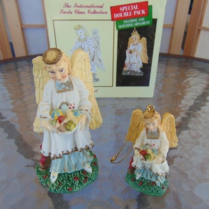 The International Santa Claus Collection Christkindl Angelic Messenger Bearing Gifts Set of Two