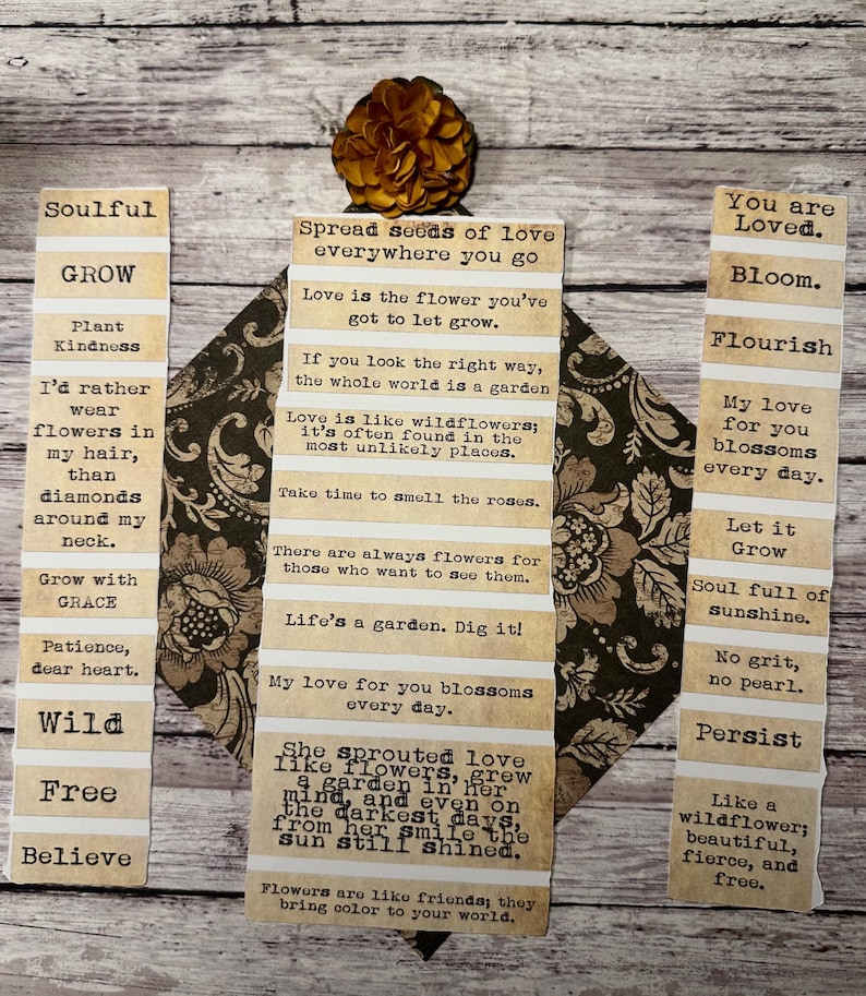 Puede incluir: Un collage decorativo con citas inspiradoras impresas en tiras de papel, dispuestas alrededor de una pieza central estampada. Las citas est&aacute;n en una fuente de m&aacute;quina de escribir, con una flor seca en la parte superior. El tema es el amor, el crecimiento y la naturaleza.