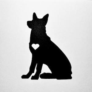 May include: Black silhouette of a dog sitting with a white heart on its chest.