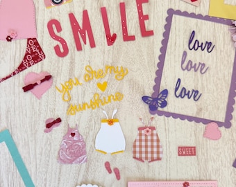 Girl Scrapbook Supplies 60 item kit Baby, Toddler Embellishments Ephemera Tags Titles Frames Baby clothing die cuts