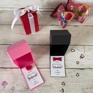 box colors - red, black, pink. add flower or bow tie