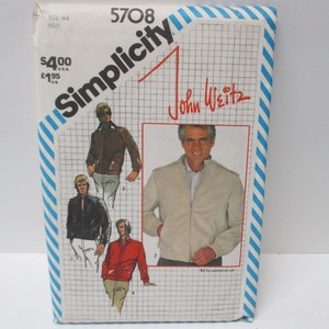 Puede incluir: Patrón de costura Simplicity número 5708 para una chaqueta, diseñado por John Weitz. El patrón incluye cuatro vistas diferentes de la chaqueta, con una chaqueta marrón, negra, roja y beige.