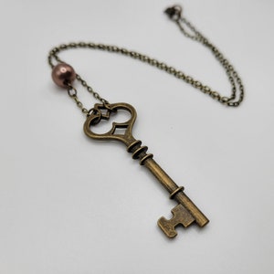 Bronze key necklace with mauve faux pearl | boho jewelry | steampunk | simple | unique | brass skeleton key | key to my heart