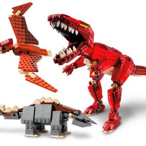 May include: Three different dinosaur toys made of LEGO bricks. A red Tyrannosaurus Rex, a gray Ankylosaurus, and a red Pterodactyl.