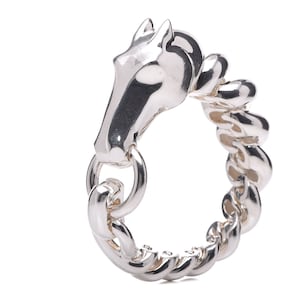 May include: A silver horse head bracelet with a chain link design.