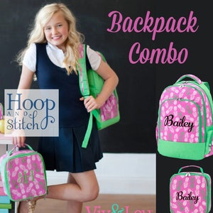 May include: Pink and green backpack and lunch bag combo with pineapple print. The backpack has a green bottom and a zippered pocket on the side. The lunch bag has a green handle. Both items are personalized with the name "Bailey".