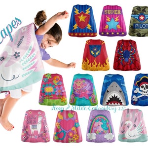 May include: A collection of colorful capes for kids featuring various designs, including a swan, a mermaid, a shark, a pirate, a llama, a heart, a unicorn, and a rainbow. The capes are made of soft fabric and are perfect for imaginative play.