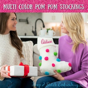 May include: Two people are holding a white knitted stocking with colorful pom-poms. The stocking is personalized with the name "Addison".