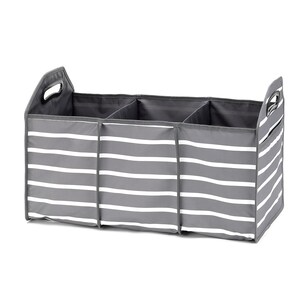 May include: A gray and white striped fabric storage bin with three compartments and two handles. The bin is designed for organizing and storing items.
