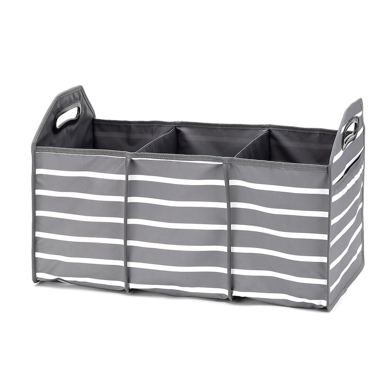 May include: A gray and white striped fabric storage bin with three compartments and two handles. The bin is designed for organizing and storing items.