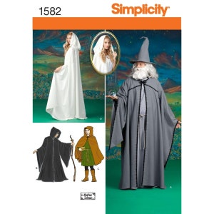 May include: Simplicity sewing pattern number 1582 for making four different hooded cloaks. The pattern includes a long white cloak, a long gray cloak, a black cloak, and a brown cloak. The pattern is designed by Andrea Schewe.
