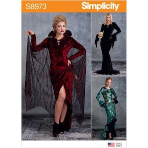 May include: Simplicity sewing pattern S8973 features three costume designs. The main image shows a woman in a burgundy velvet dress with a high collar and a sheer black cape. Other designs include a black gown and a green sequined dress.