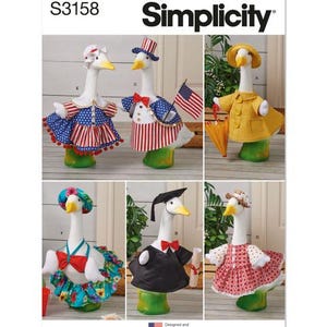 May include: Simplicity pattern S3158 features goose figurines in various outfits. The geese are dressed in patriotic attire, a yellow raincoat, a floral ensemble, a graduation gown, and a red polka-dot dress. The pattern is designed and printed in the USA.