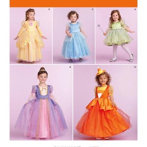 May include: Simplicity pattern 1303 featuring five children's costume designs. The costumes include princess and fairy dresses in various colors like yellow, blue, green, purple, and orange. The pattern is designed and printed in the USA.