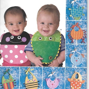 May include: A sewing pattern for making baby bibs. The pattern includes instructions for making seven different bibs with various animal designs, including a ladybug, a frog, a crab, a bear, a bee, a cat, and an owl. The pattern is from Simplicity and is size one.