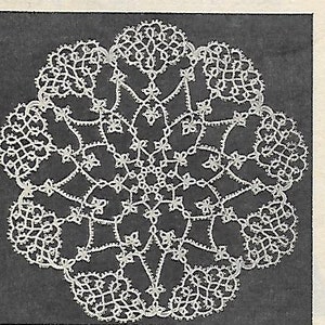 May include: A white crocheted doily with a delicate floral design. The doily is circular and has a center with a starburst pattern.