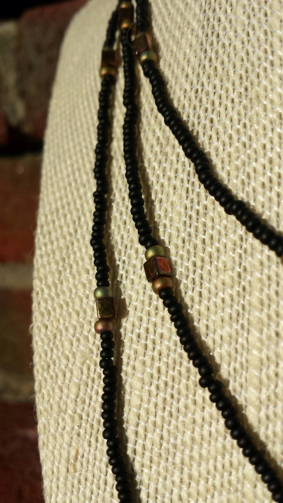 Items similar to Classy black and brownaccented wraparound necklace