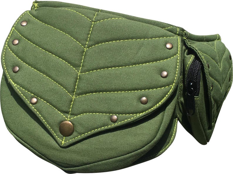 May include: Olive green leaf-shaped fanny pack with a flap and a zippered pocket. The bag features quilted detailing with lime green stitching and is adorned with bronze-colored rivets and a button closure. A unique and stylish accessory.