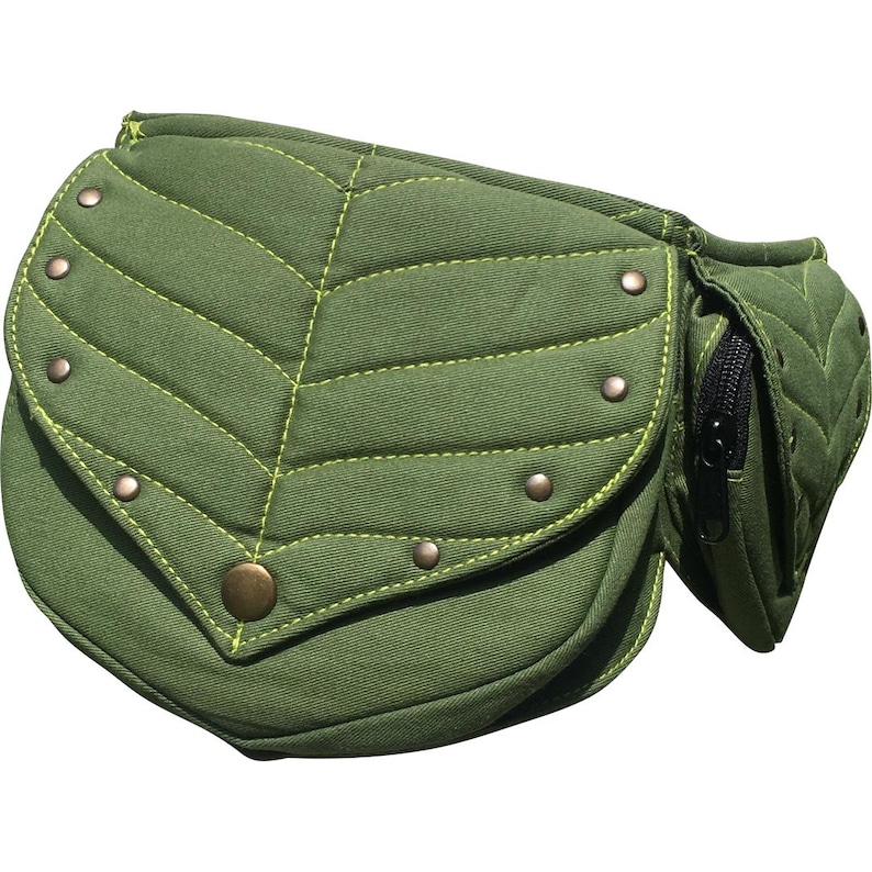 May include: A green leaf-shaped fanny pack with a zippered pocket. The bag is made of a textured fabric with yellow stitching and metal rivets. The main compartment has a large, rounded flap with a brass button closure.