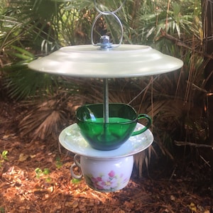 Unique bird feeder using two tea cups, saucer and plate