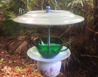 Unique bird feeder using two tea cups, saucer and plate