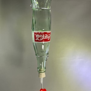 Alimentador de garrafa de Coca-Cola Hummingbird de 12 onças. Coca Cola