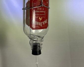 Jack Daniels Tennessee Fire Liquor bottle small hummingbird feeder. 100ml. Hand wire wrapped. Labels sealed with epoxy resin.