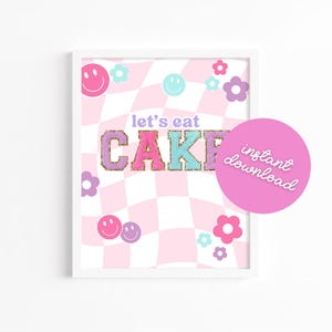 May include: A printable digital download for a pink and white checkered background with the text "Let's eat cake" in pink, purple, and blue letters with gold glitter accents. The background also features pink and purple flowers and smiley faces.