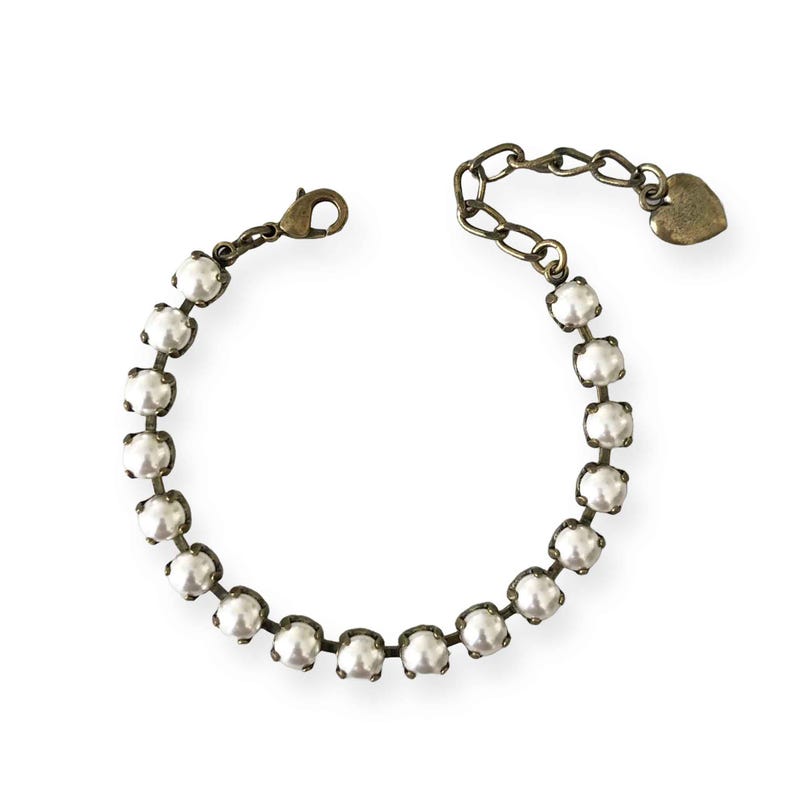 Antique brass bracelet with faux pearls (tennis style).