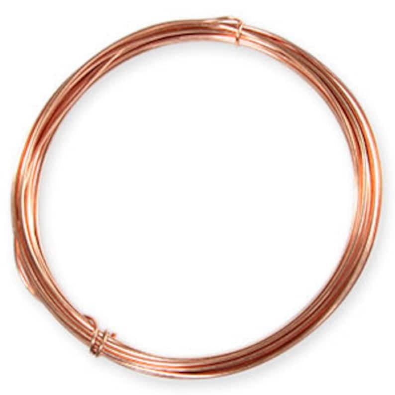 May include: Coil of copper wire, tightly wound in a circular shape. The wire has a bright, reddish-brown color and appears smooth. This craft supply is suitable for jewelry making, wire wrapping, or other artistic projects.