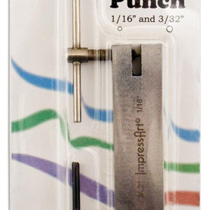 May include: A silver two-hole punch with a black handle. The punch is labeled "Impress Art" and has two holes, one 1/16 inch and one 3/32 inch.