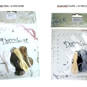 May include: Two Kumihimo craft kits in clear plastic packaging. One kit includes a disc and 8 yards of cord, the other a plate and 10 yards of cord. Each kit contains a white, black, tan, and brown cord. The brand name "Dazzle-it" is visible.