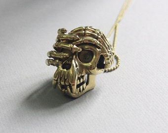 Colgante/collar con calavera de simio con cara oculta
