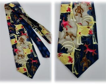 May include: A blue silk tie with a pattern of stylized animals and geometric shapes in yellow, red, and white.