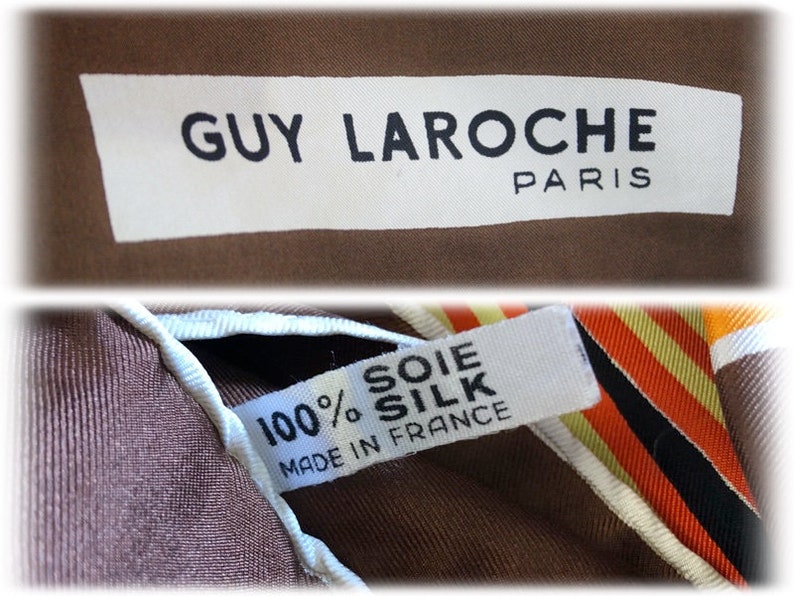 May include: A brown silk scarf with a white label that reads "GUY LAROCHE PARIS" and a smaller white label that reads "100% SOIE SILK MADE IN FRANCE".
