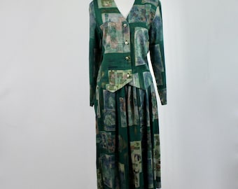 May include: A vintage green two-piece dress set on a mannequin. The set includes a long-sleeved jacket with button closures and a pleated midi skirt. The fabric features a repeating abstract pattern in shades of green, blue, and tan.