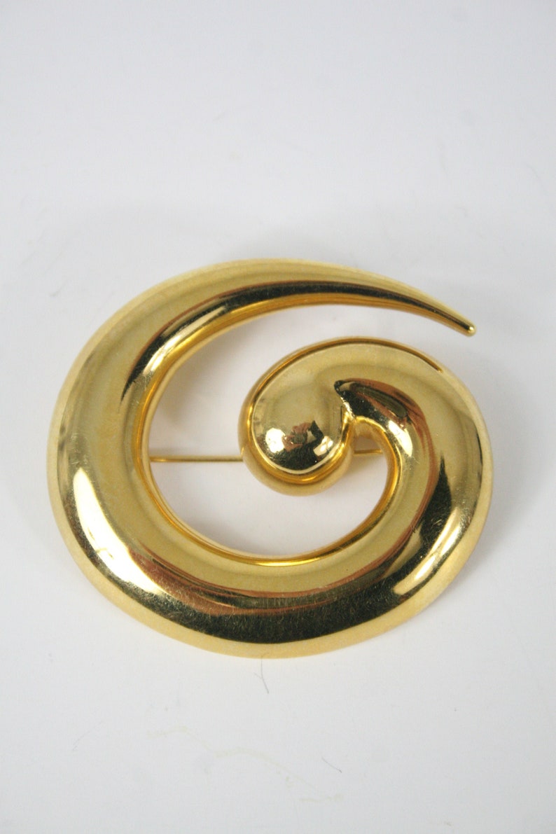 large gold brooch