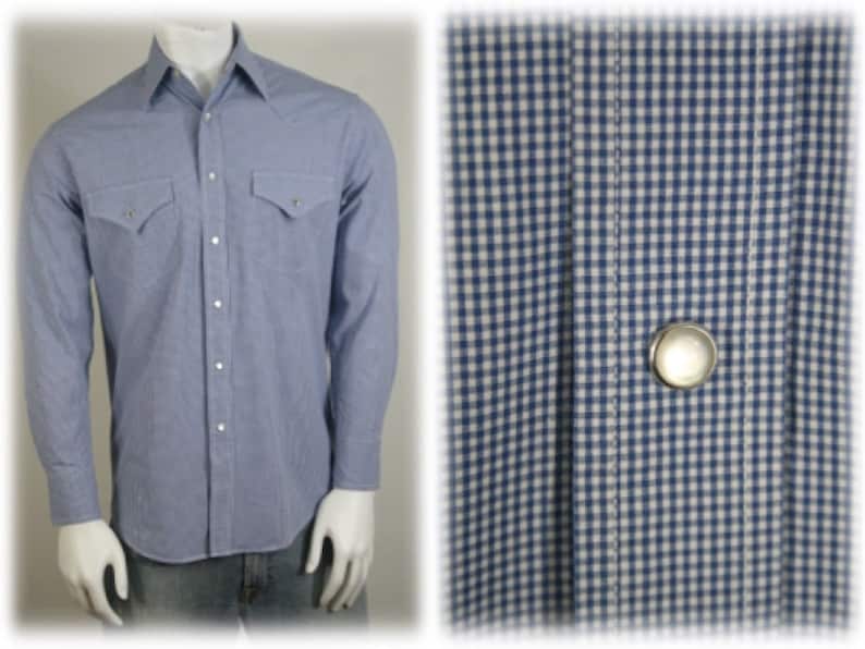 May include: A light blue long-sleeved shirt with a white and blue gingham pattern. The shirt has a button-down collar, two chest pockets, and a single button closure at the front.