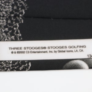 Cravate Homme Three Stooges Golfing - Ralph Marlin - Comédie - NEUVE Avec étiquette