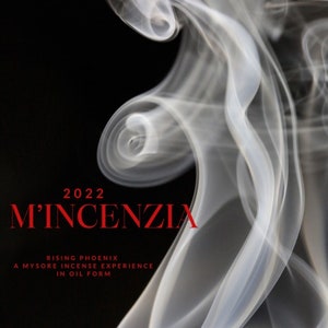 May include: A white smoke plume against a black background with the text "2022 M'INCENZIA RISING PHOENIX A MYSORE INCENSE EXPERIENCE IN OIL FORM" in red.