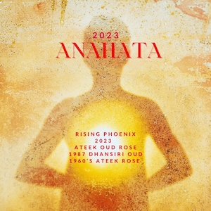 May include: A golden-yellow abstract image featuring a person's silhouette. The word "ANAHATA" is in red, with "2023" above it. Below, the text reads "RISING PHOENIX 2023" and lists fragrance names.