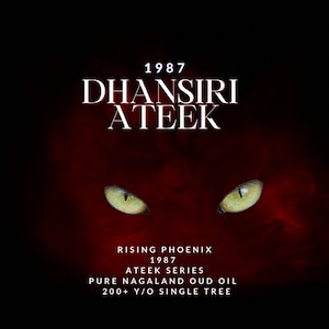 May include: A deep red background with white text reading "1987 DHANSIRI ATEEK". Beneath, white text states "RISING PHOENIX 1987 ATEEK SERIES PURE NAGALAND OUD OIL 200+ Y/O SINGLE TREE". Two green eyes are visible.